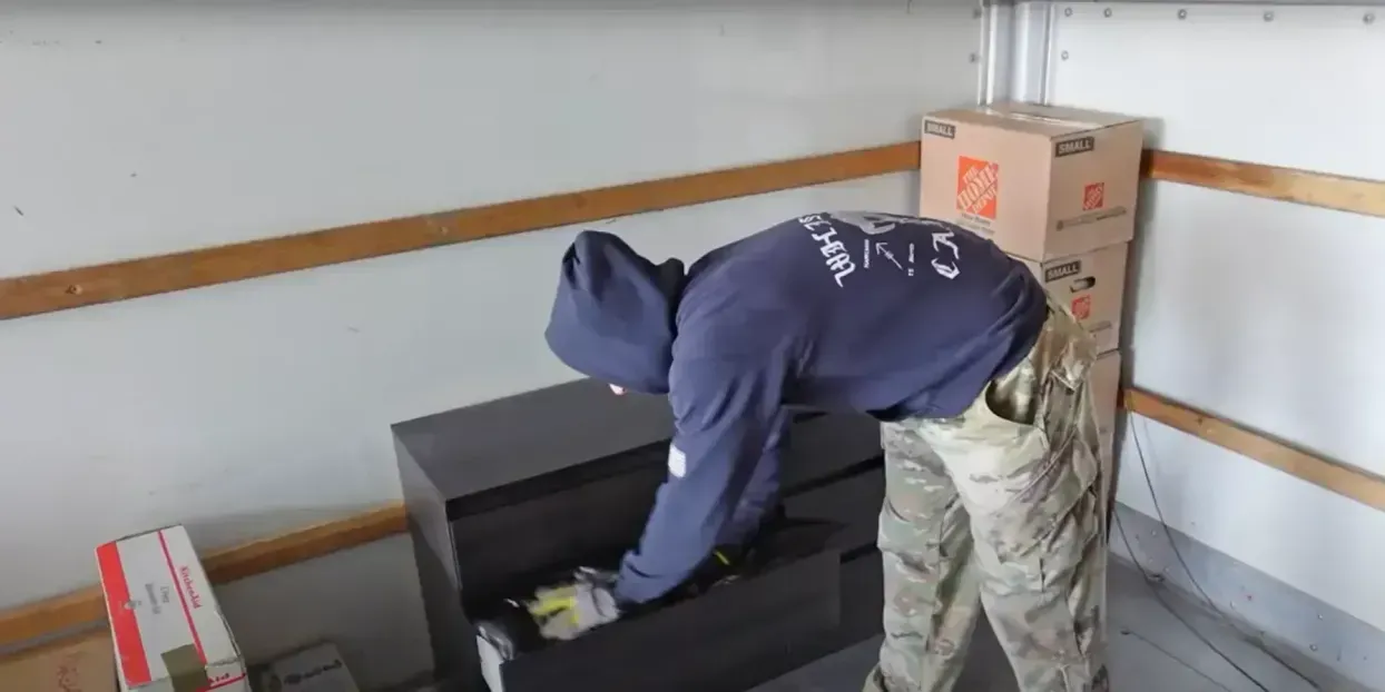 Professional movers carrying boxes